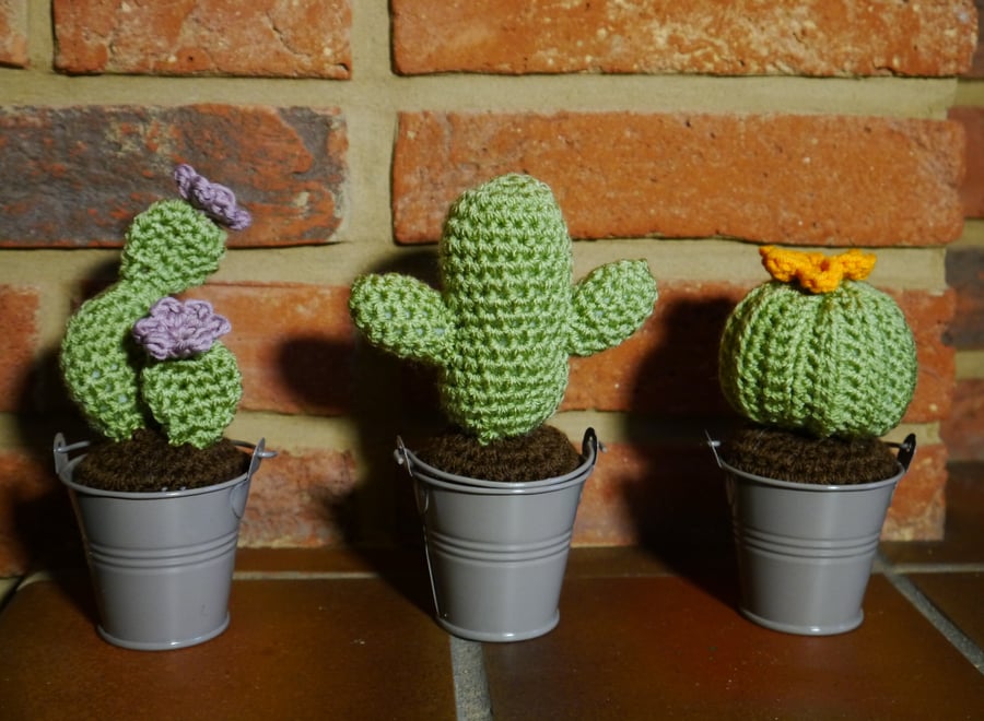 Crochet cacti in metal buckets, set of three orange and lilac flowers. 
