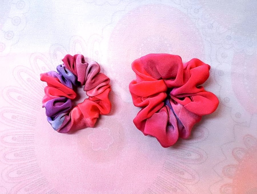 Two small silk painted hair bands.