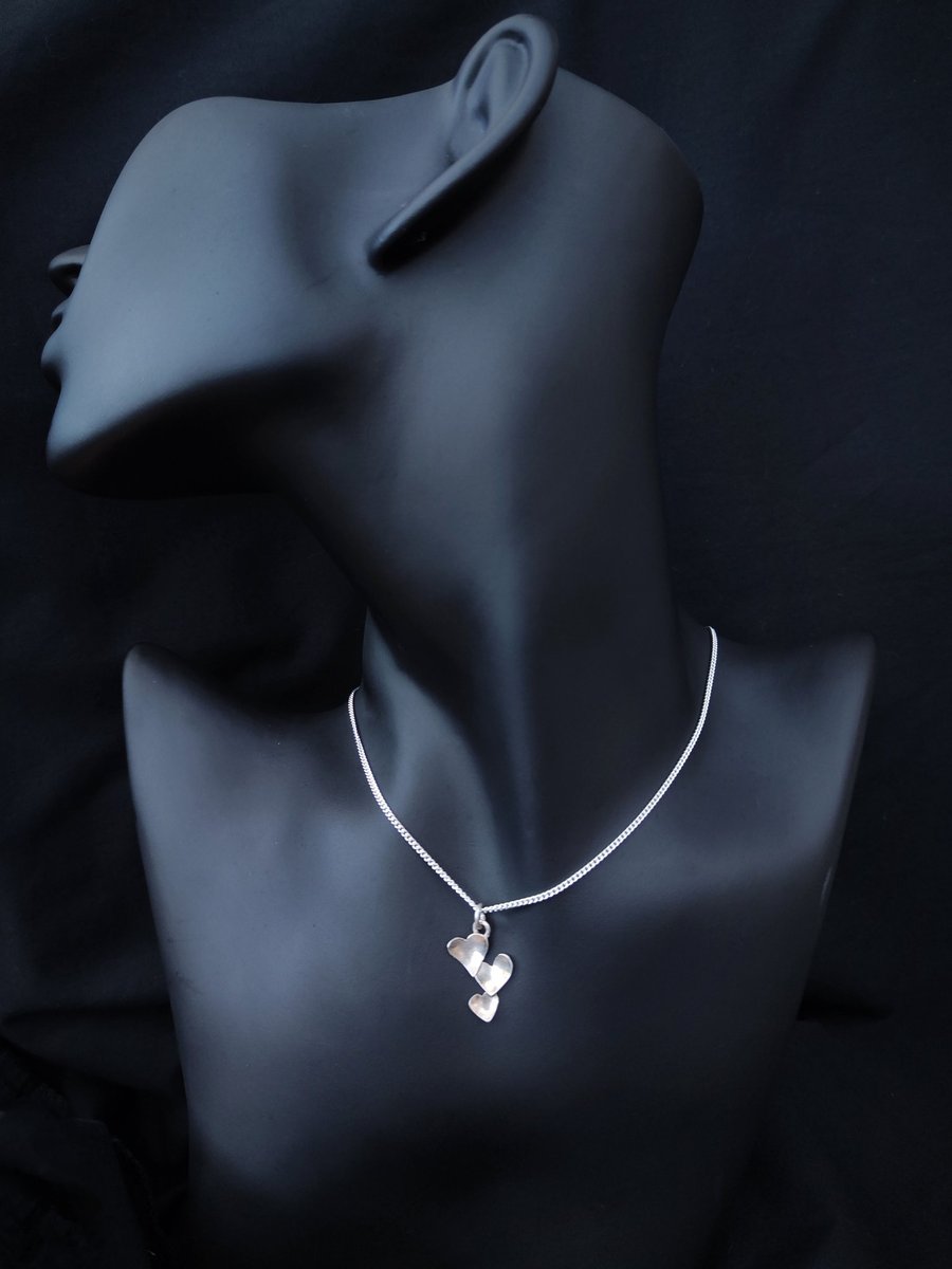 Silver pendant with little hearts