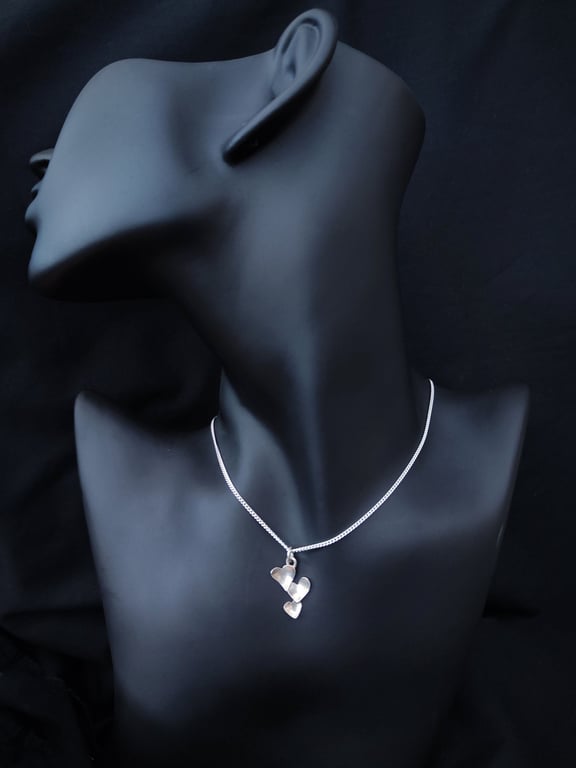 Silver pendant with little hearts