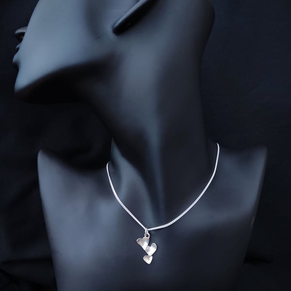 Silver pendant with little hearts