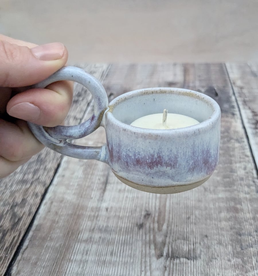 White and purple ceramic tealight holder with handle