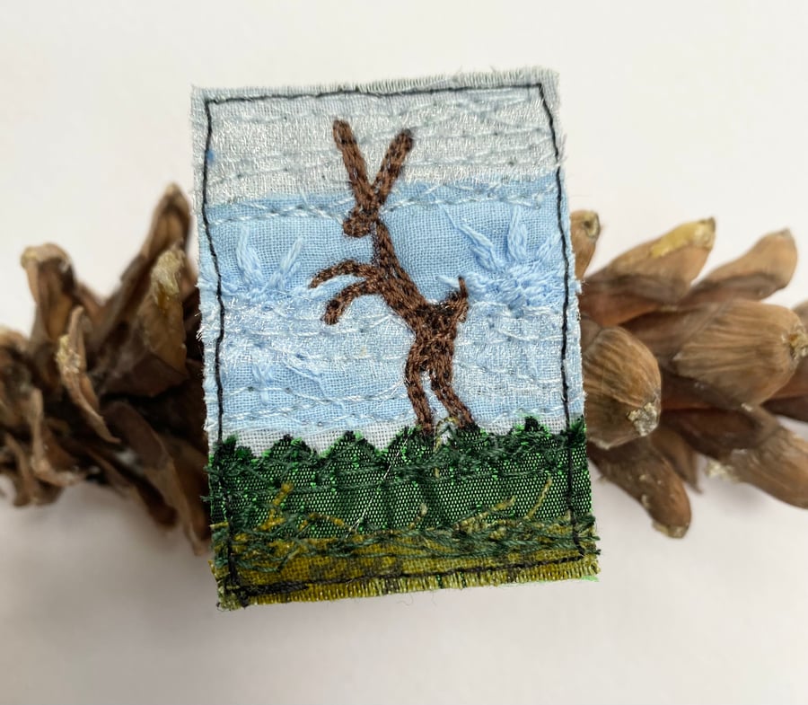 Upcycled boxing hare brooch pin or badge. 