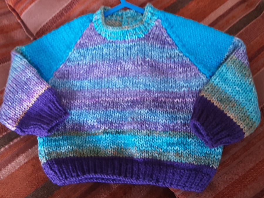 Sky blue patterned hand knitted baby jumper 