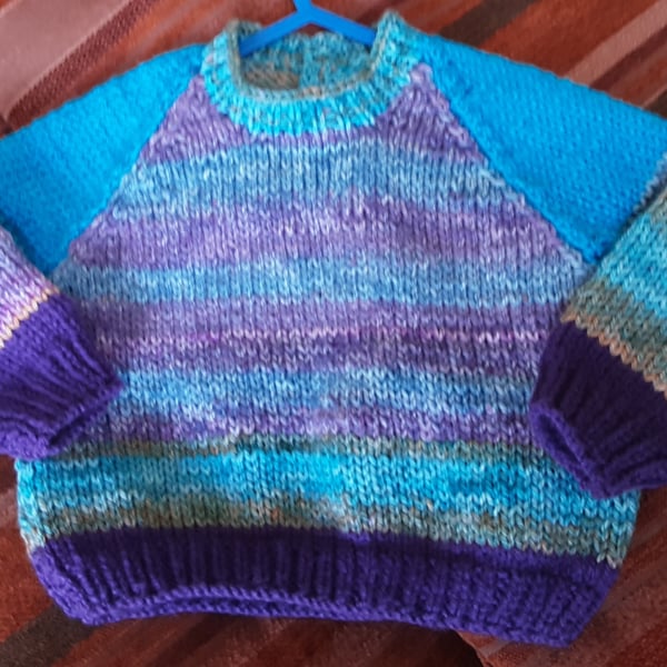 Sky blue patterned hand knitted baby jumper 