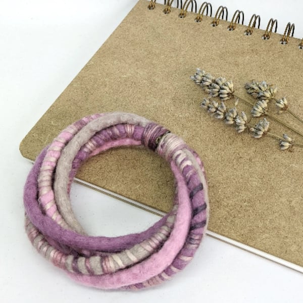 Felted cord bracelet in shades of pink