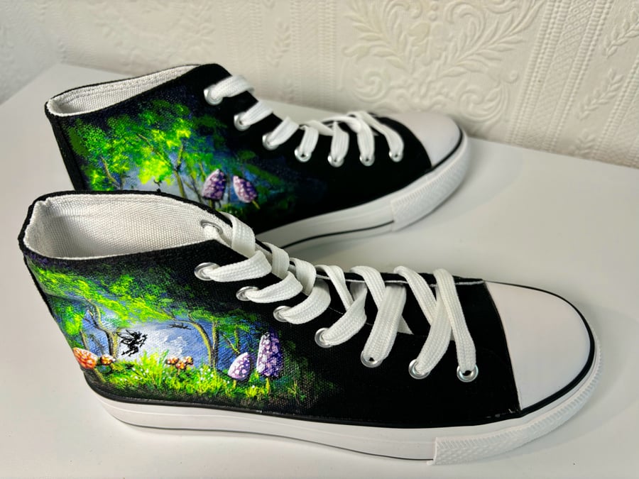 A pair of hand painted and sealed high tops by Andrew Jenkins 