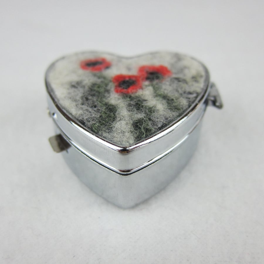 Pill box or trinket box with poppy decoration, heart shaped