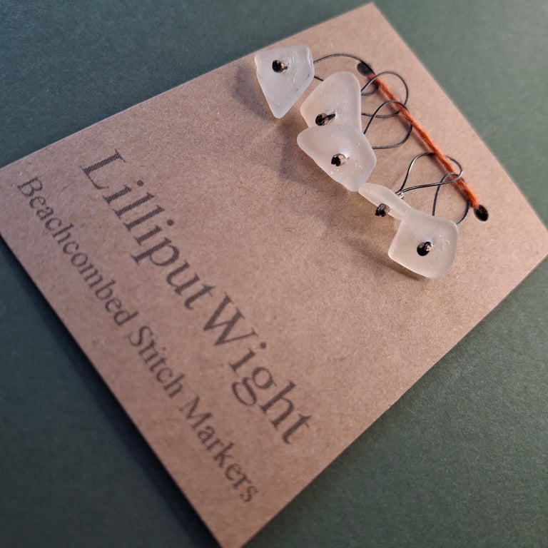 Five white sea glass stitch markers