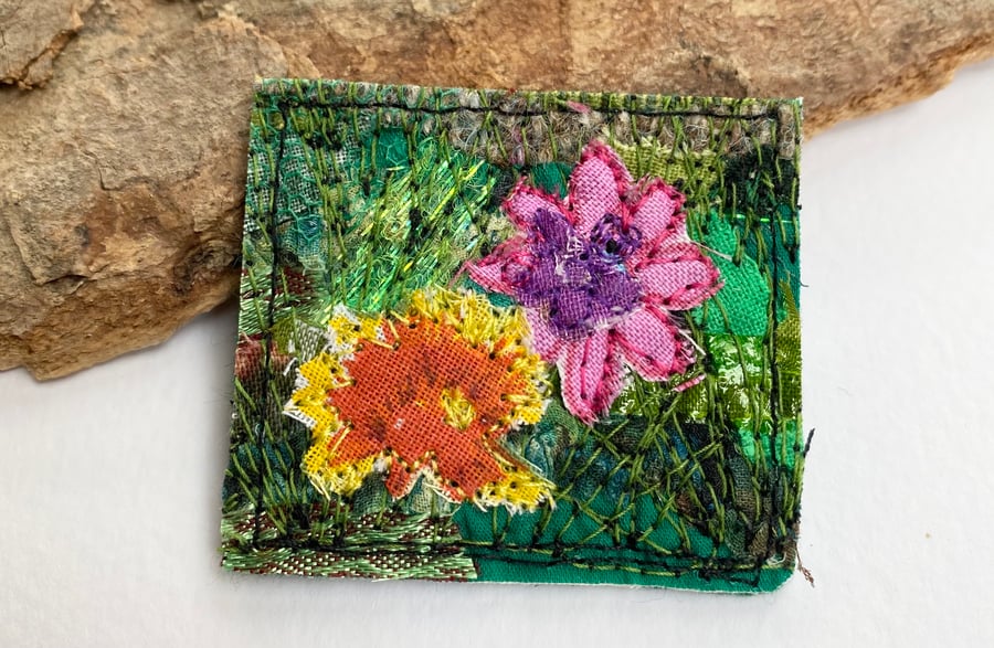 Upcycled flower garden brooch pin or badge. 