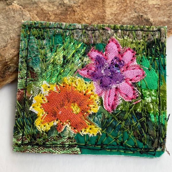 Upcycled flower garden brooch pin or badge. 