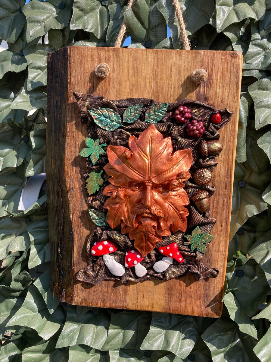 Copper Coloured Green Man mounted on wood