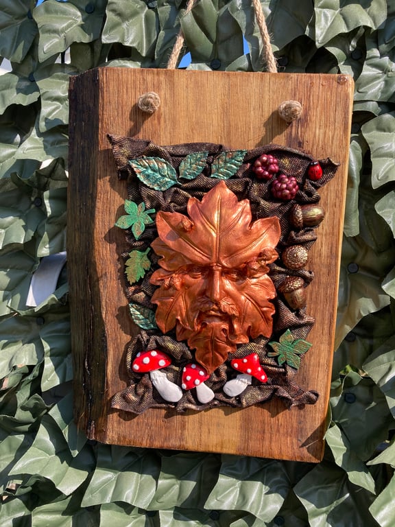 Copper Coloured Green Man mounted on wood