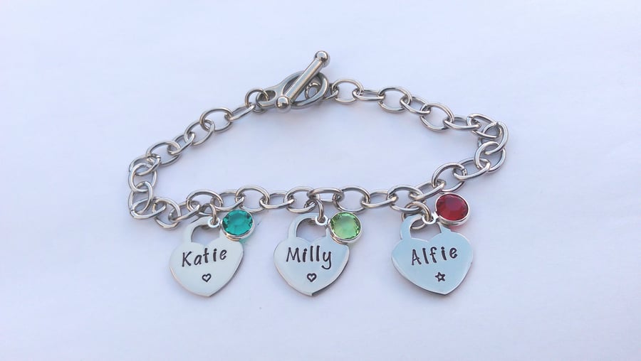 Hand stamped personalised charm bracelet with tiffany style heart charms