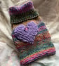 Hand knitted hot water bottle cover