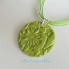 SALE - Green ceramic pendant necklace impressed with a floral design 