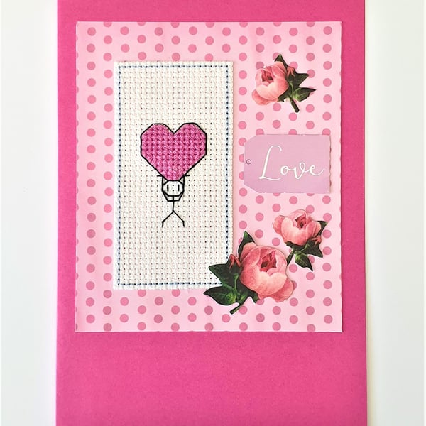 Stickman with a pink heart cross stitch card with Love wording and rose detail