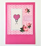 Stickman with a pink heart cross stitch card with Love wording and rose detail