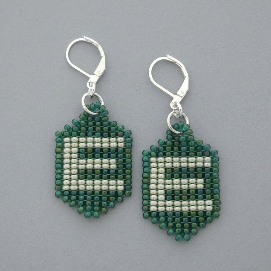 Letter E glass beaded earrings with silver plated leverback hinged ear wires. 