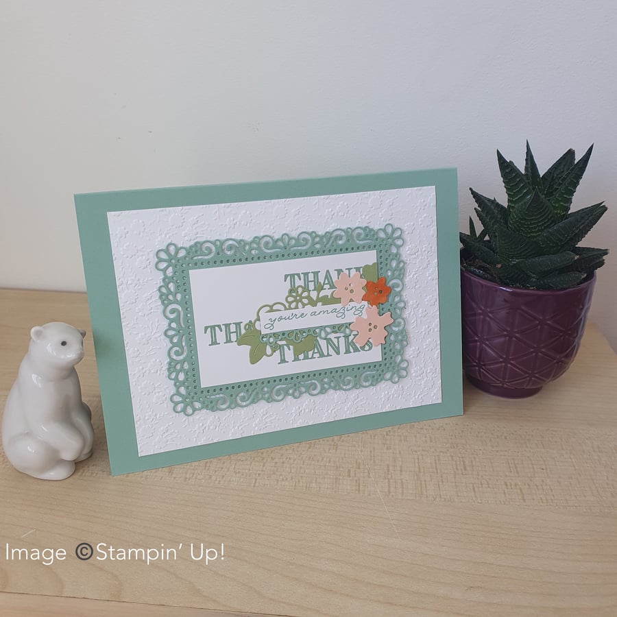 A floral embossed thank you card