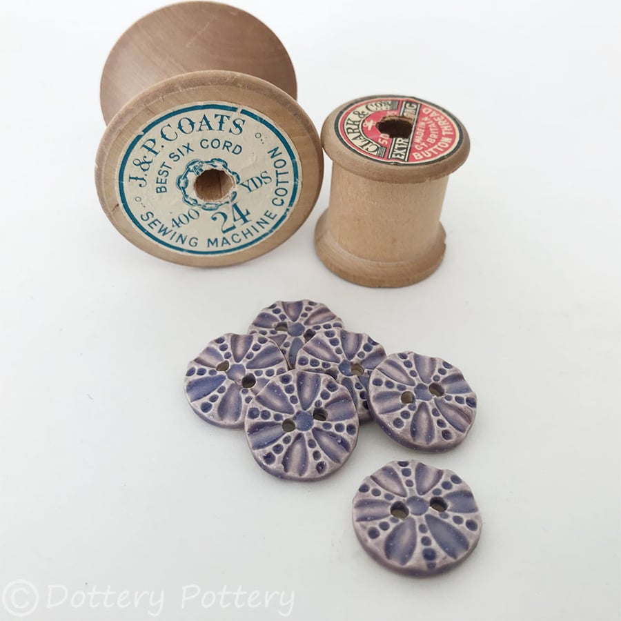 Set of six little purple coloured round ceramic handmade buttons