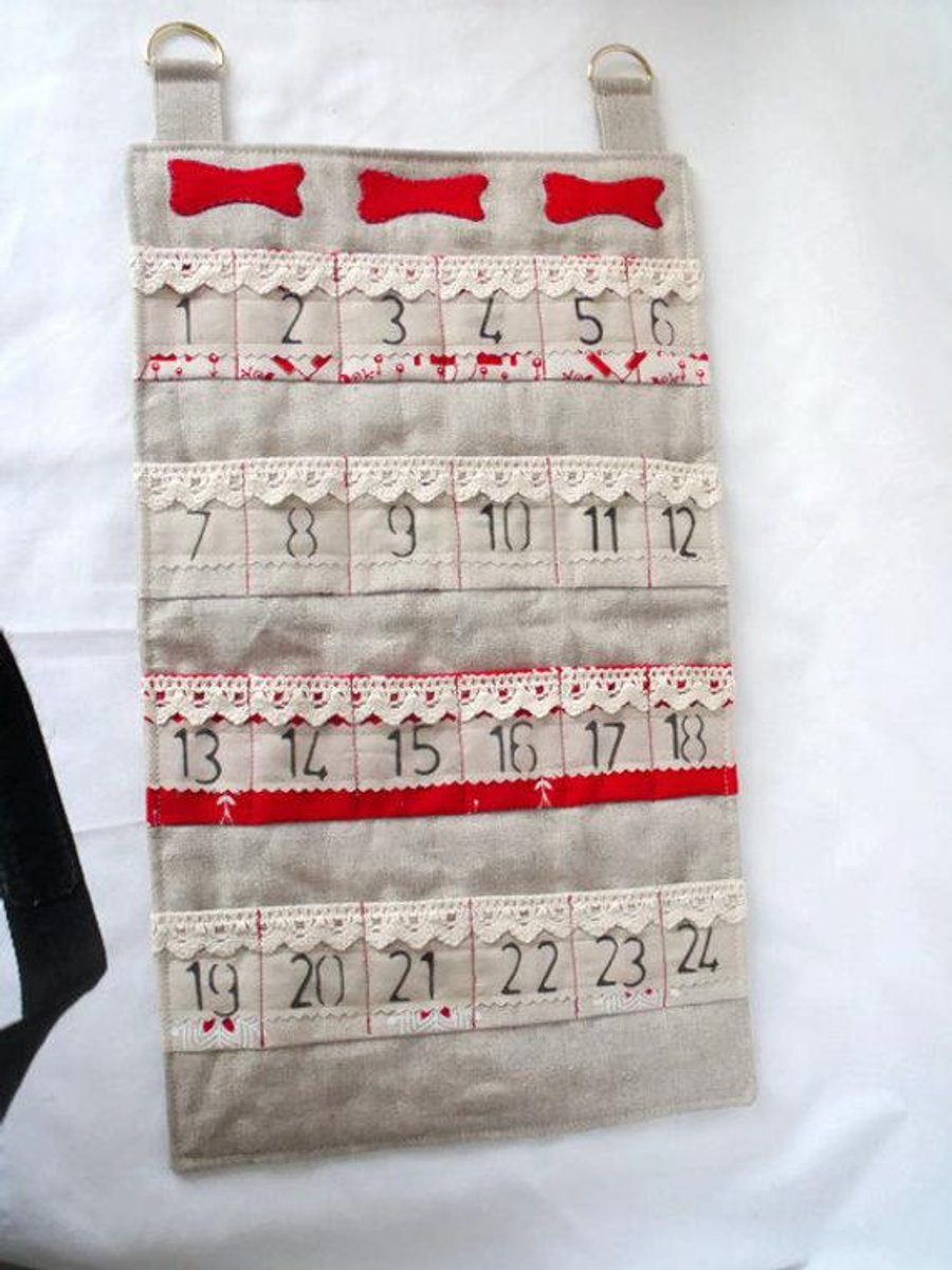 dog bones hanging christmas advent calendar for storing small gifts or treats in