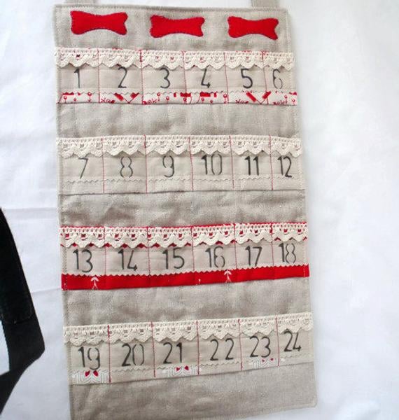 dog bones hanging christmas advent calendar for storing small gifts or treats in