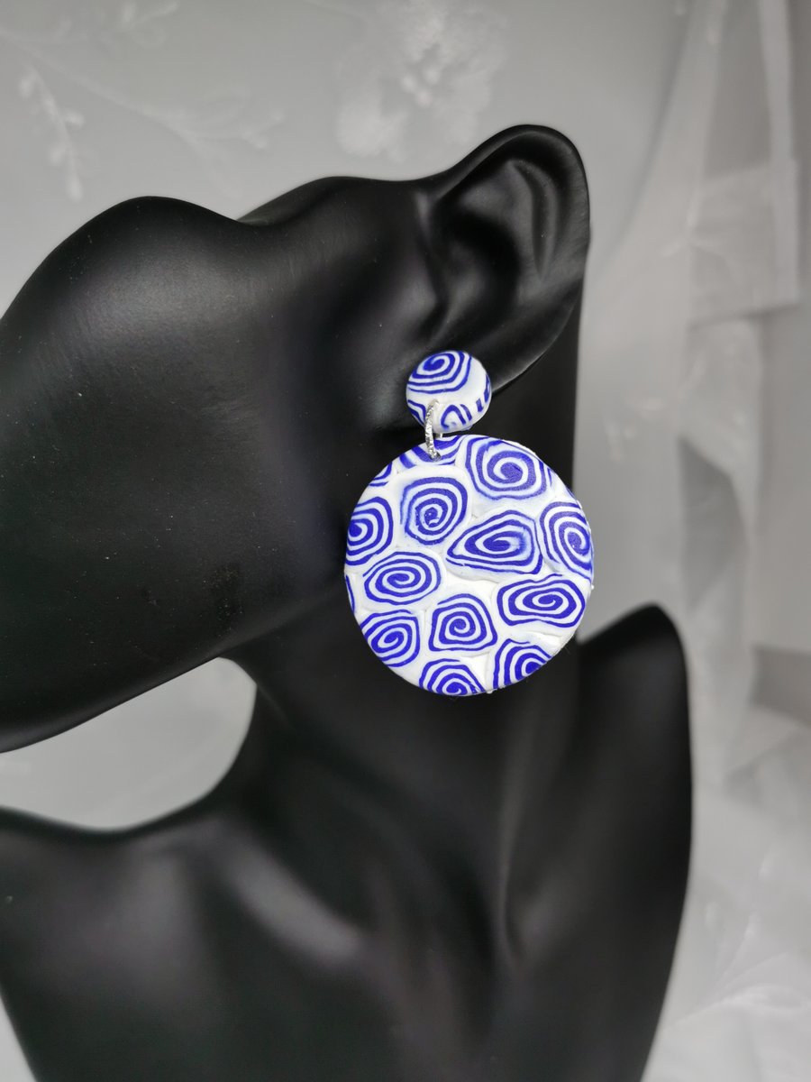 Attention grabbing disc earrings, blue and white swirl  design. Drop earrings.