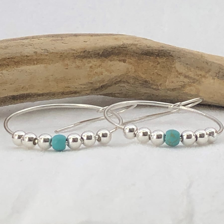 Hoop earrings with turquoise bead