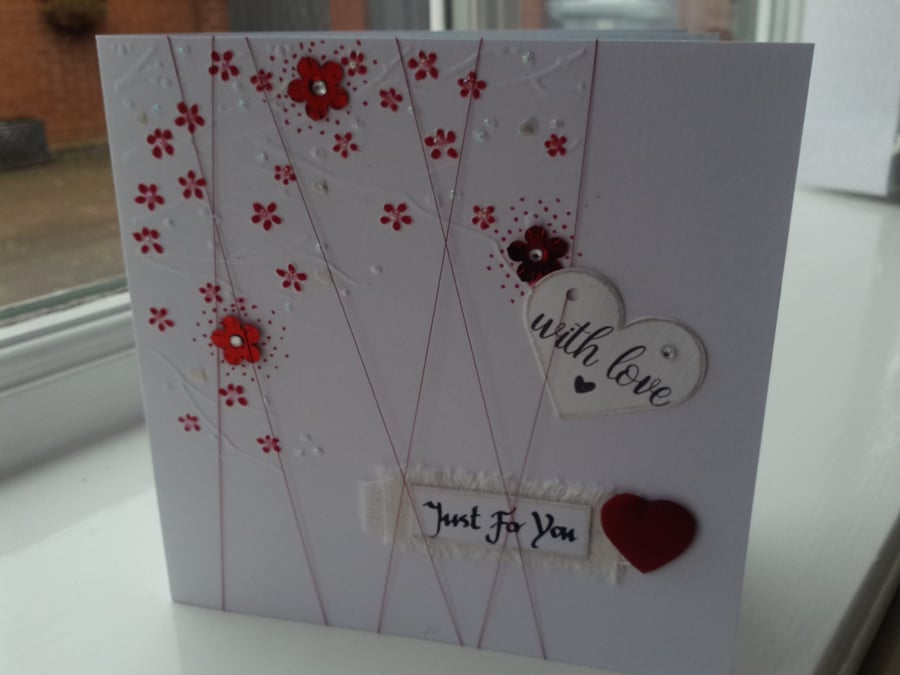 Red blossom with love card