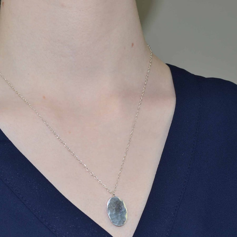 Textured silver oval pendant