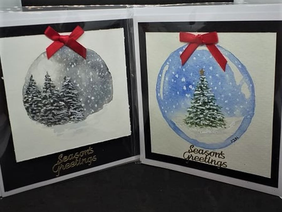 2 x watercolour Christmas cards depicting wintry snowglobe scenes