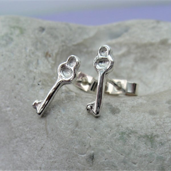 Silver key stud earrings