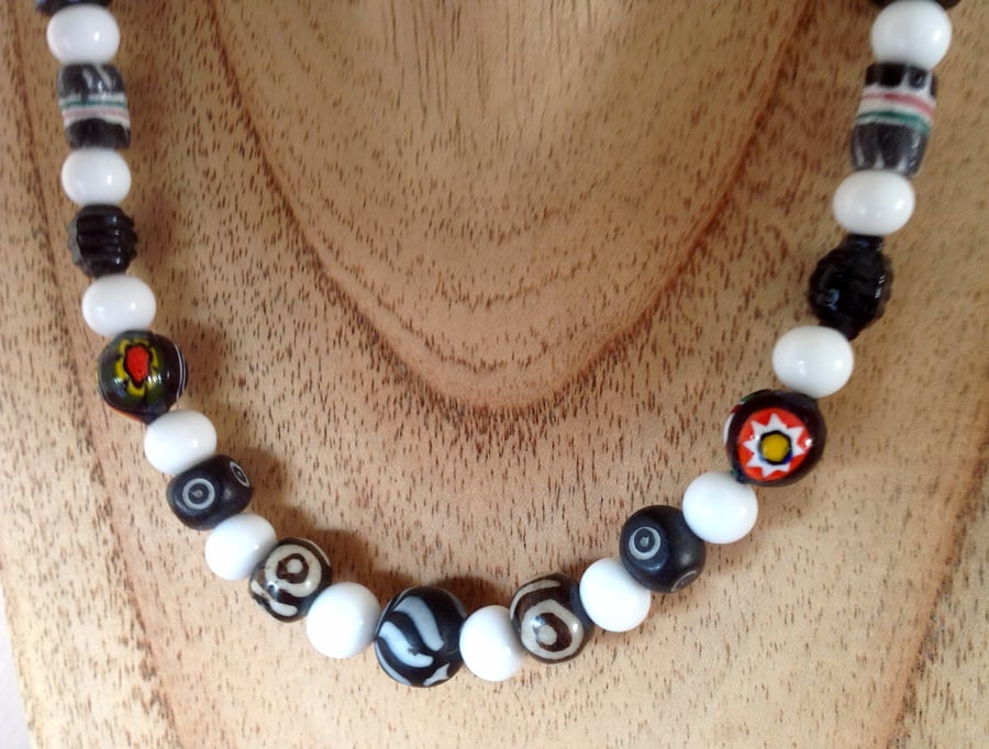 Beaded necklace with a collection of black and white beads