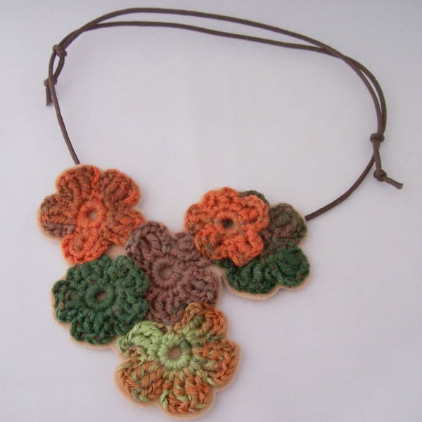 Crochet flower necklace in brown, orange and green, perfect for the boho gal