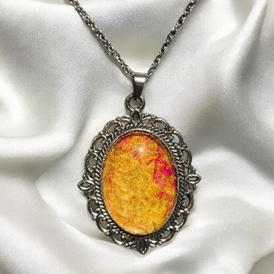 Vintage style pendant necklace using handmade felt under glass cabochon, orange