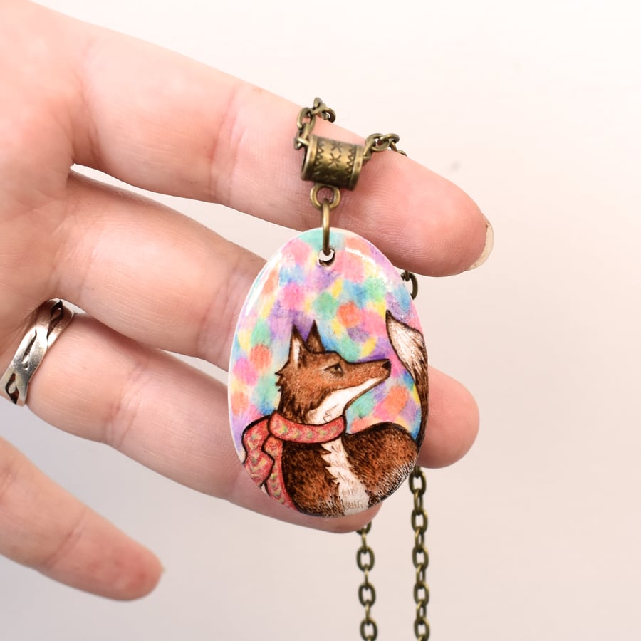 A festive fox and fairy lights. Pyrography wood pendant of fox and scarf.