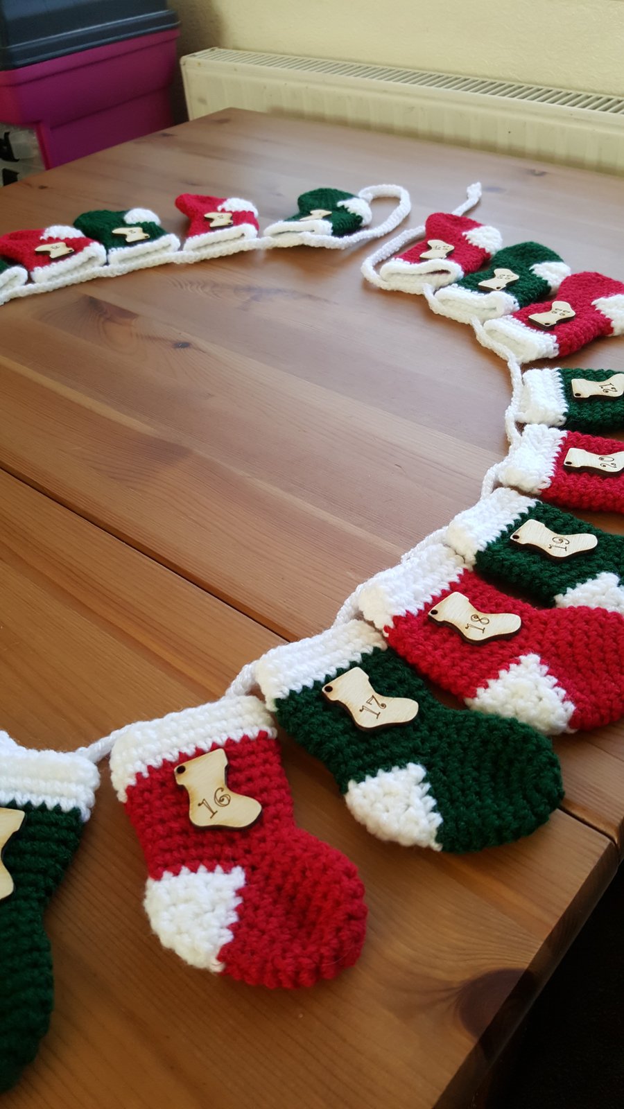 festive crocheted christmas stocking garland, red and green