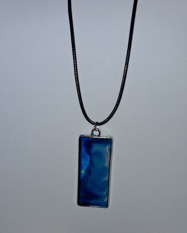 Handmade resin blue and pink rectangular pendant on  black waxed cord