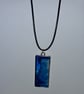 Handmade resin blue and pink rectangular pendant on  black waxed cord