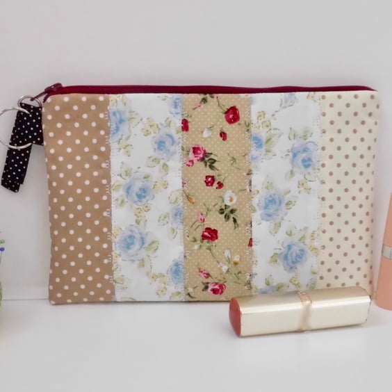 Make up bag using a patchwork of cotton fabrics.