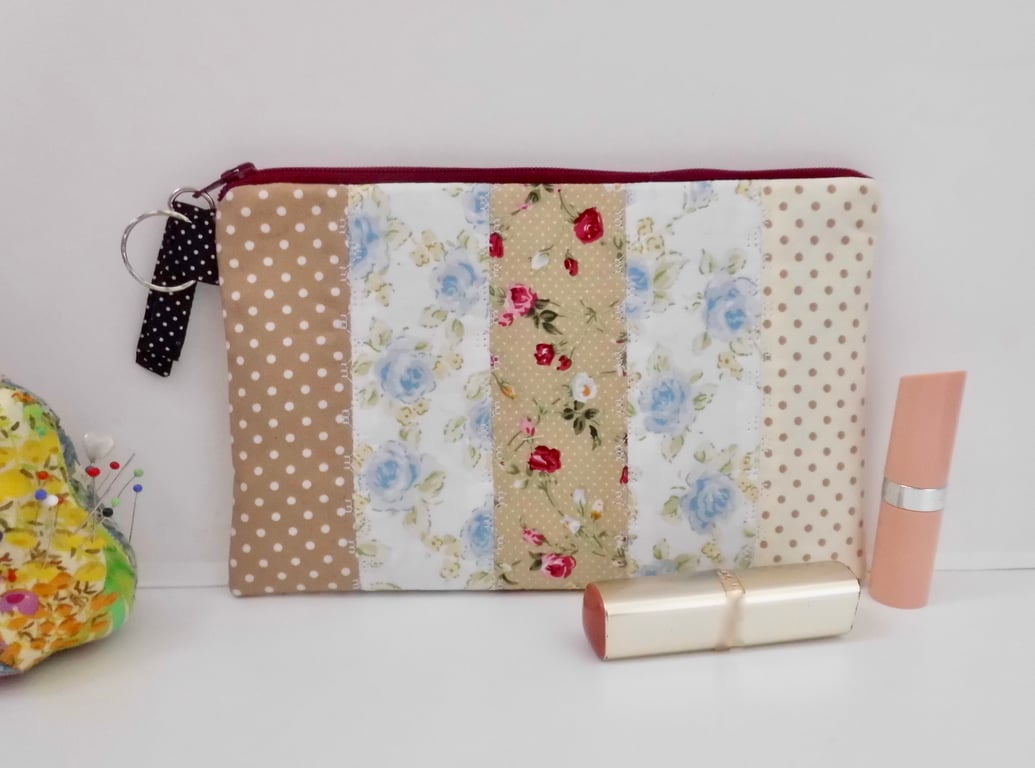 Make up bag using a patchwork of cotton fabrics.