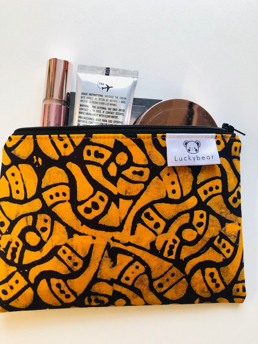 Orange & black zip pouch in striking block print fabric
