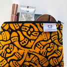 Orange & black zip pouch in striking block print fabric