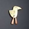 bird brooch with long pink legs