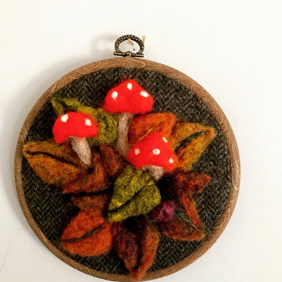 needle felted wall decor of toadstools in embroidery hoop