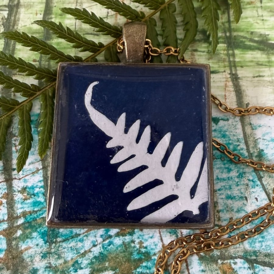 Image of Cyanotype print necklace pendant.