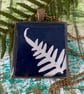 Cyanotype print necklace pendant.