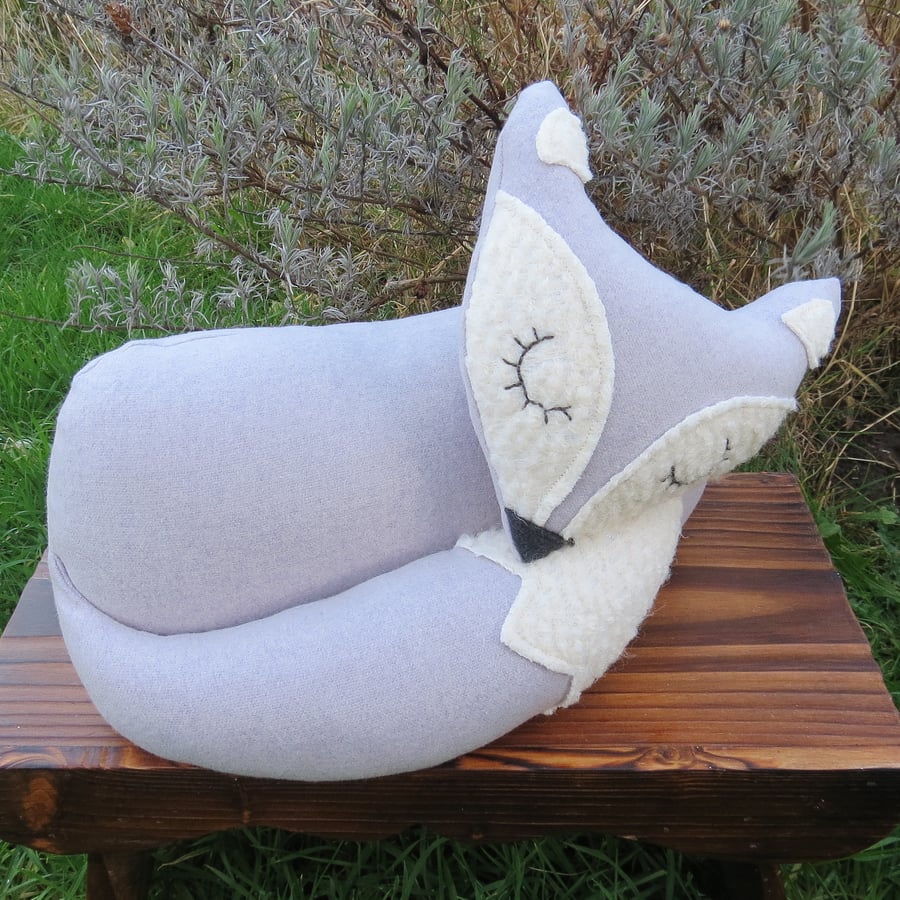 Lavender grey.  A snoozy fox cushion.  33cm in length.