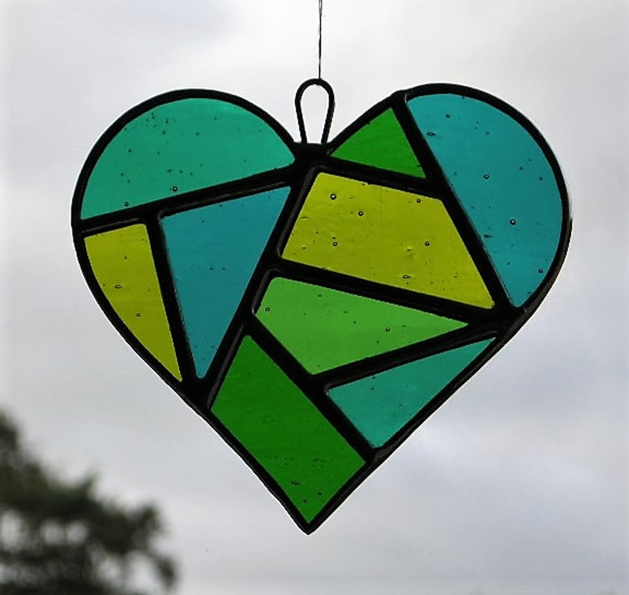 Stained Glass suncatcher Love Heart in a mixture of greens and textured glass